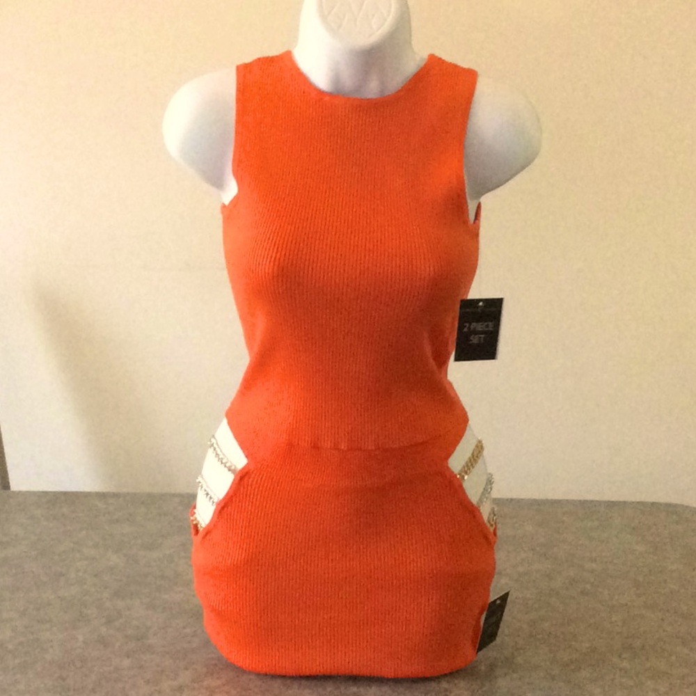 a ribbed knit crop top and chain detail skirt set